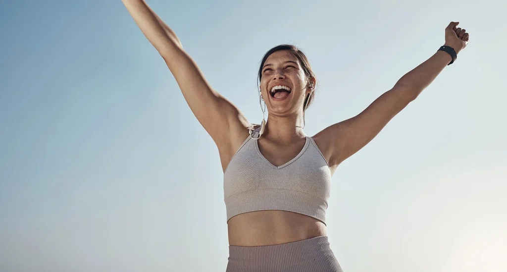 Woman raising her arms