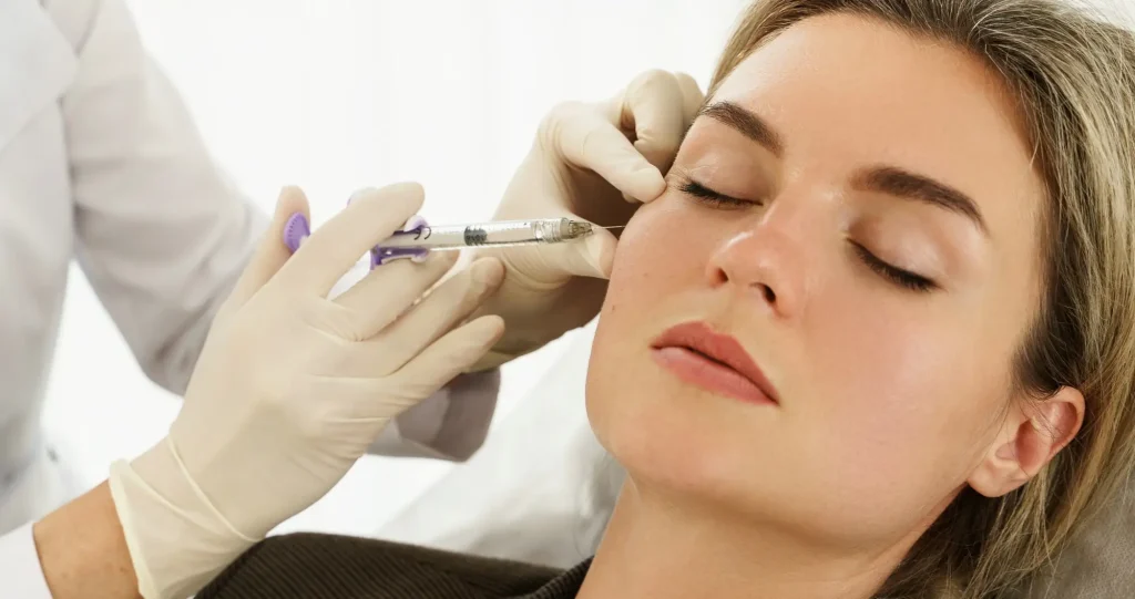 woman receiving a HA filler injection