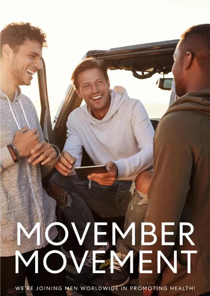 3 men laughing next to car